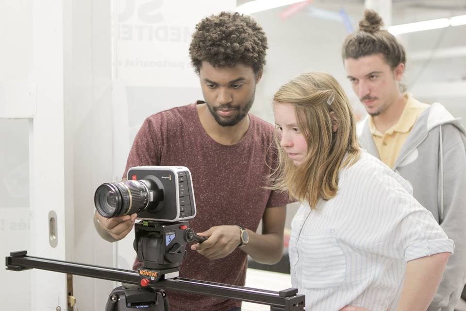 A cameraman and his assistants.